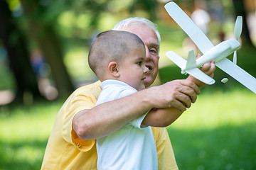 Image showing grandfather and child have fun  in park