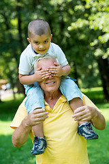 Image showing grandfather and child have fun  in park