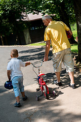 Image showing grandfather and child have fun  in park