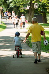 Image showing grandfather and child have fun  in park