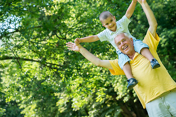 Image showing grandfather and child have fun  in park