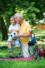 Image showing grandfather and child have fun  in park