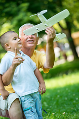 Image showing grandfather and child have fun  in park