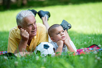 Image showing grandfather and child have fun  in park