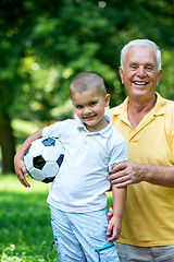 Image showing grandfather and child have fun  in park