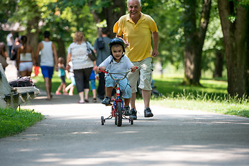 Image showing grandfather and child have fun  in park