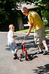 Image showing grandfather and child have fun  in park