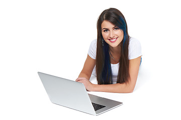 Image showing Woman lying on the floor with laptop