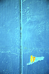 Image showing dirty stripped paint in the yellow rusty nail