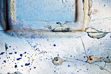 Image showing dirty stripped  in   blue  door and rusty  