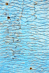 Image showing dirty  paint in the blue wood  rusty nail