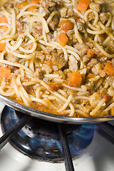 Image showing spaghetti bolognese cooking on stove