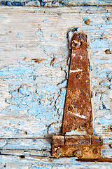 Image showing morocco in  old wood  facade home and rusty safe padlock 