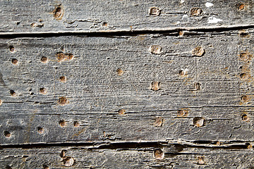 Image showing nail dirty stripped paint in   wood  and rusty red