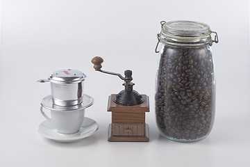 Image showing Vietnam style coffee and manual grinder and coffee bean