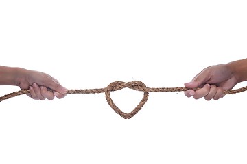 Image showing Two hand pulling a rope with heart shape