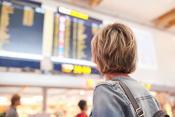 Image showing Woman with backpack going on boarding