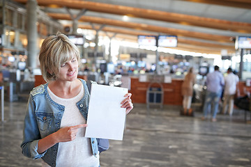 Image showing Woman with backpack going on boarding