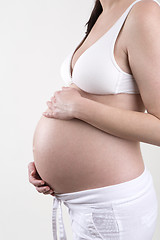 Image showing Pregnant woman in front of a white background