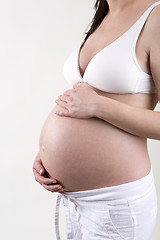 Image showing Pregnant woman in front of a white background