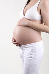 Image showing Pregnant woman in front of a white background