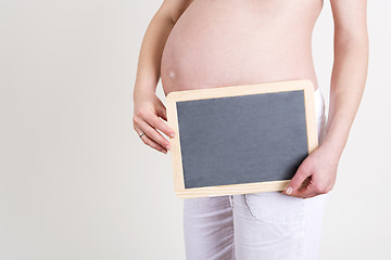Image showing Pregnant woman with an empty blackboard