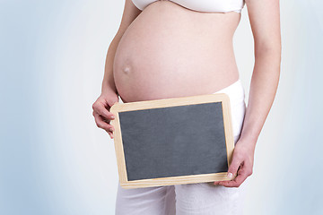 Image showing Pregnant woman with an empty blackboard