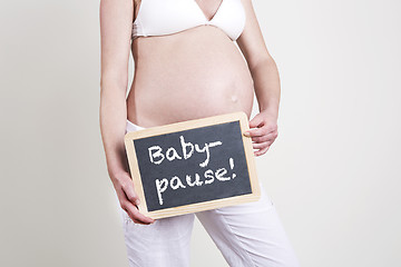 Image showing Pregnant woman with an empty blackboard