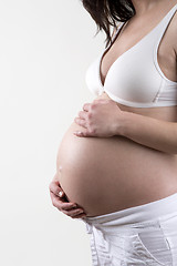 Image showing Pregnant woman in front of a white background