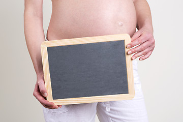 Image showing Pregnant woman with an empty blackboard