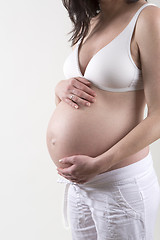 Image showing Pregnant woman in front of a white background