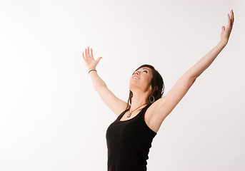 Image showing Woman Celebrates Winning Attitude Arms Outstretched Reaching Upw