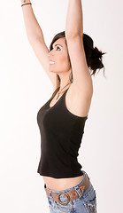 Image showing Woman Celebrates Winning Attitude Arms Outstretched Reaching Upw