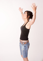 Image showing Woman Celebrates Winning Attitude Arms Outstretched Reaching Upw