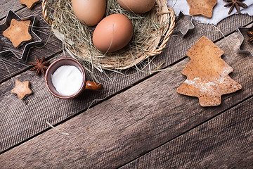 Image showing Ingredients for Christmas pastry and cookies on wood 