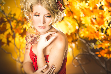 Image showing Magic gold autumn blonde girl portrait in leafs