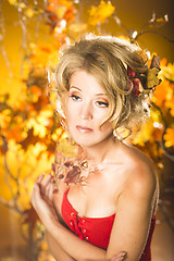 Image showing Magic gold autumn blonde girl portrait in leafs