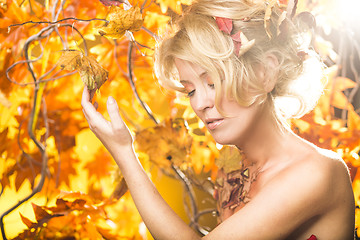 Image showing Magic gold autumn blonde girl portrait in leafs