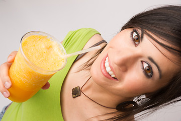 Image showing Attractive Woman Intimate Portrait Drinking Orange Fruit Smoothi