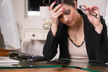 Image showing Business Woman Office Manager Rubs Head Depression Sadness