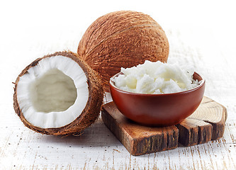 Image showing bowl of coconut oil and fresh coconuts