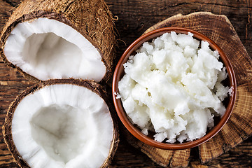 Image showing bowl of coconut oil and fresh coconuts