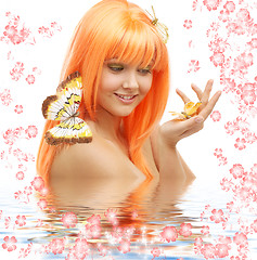 Image showing butterfly girl with flowers in water