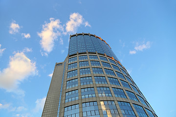 Image showing Office modern building against the evening sky with white clouds