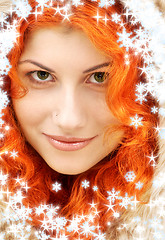 Image showing lovely redhead in fur with snowflakes