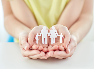 Image showing close up of woman and girl hands with paper family