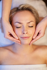 Image showing close up of woman having face massage in spa