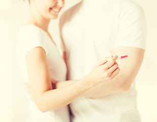 Image showing woman and man hands with pregnancy test