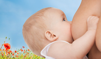 Image showing close up of mother breast feeding adorable baby