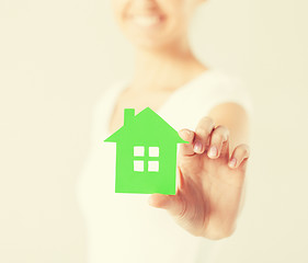 Image showing woman hands holding green house